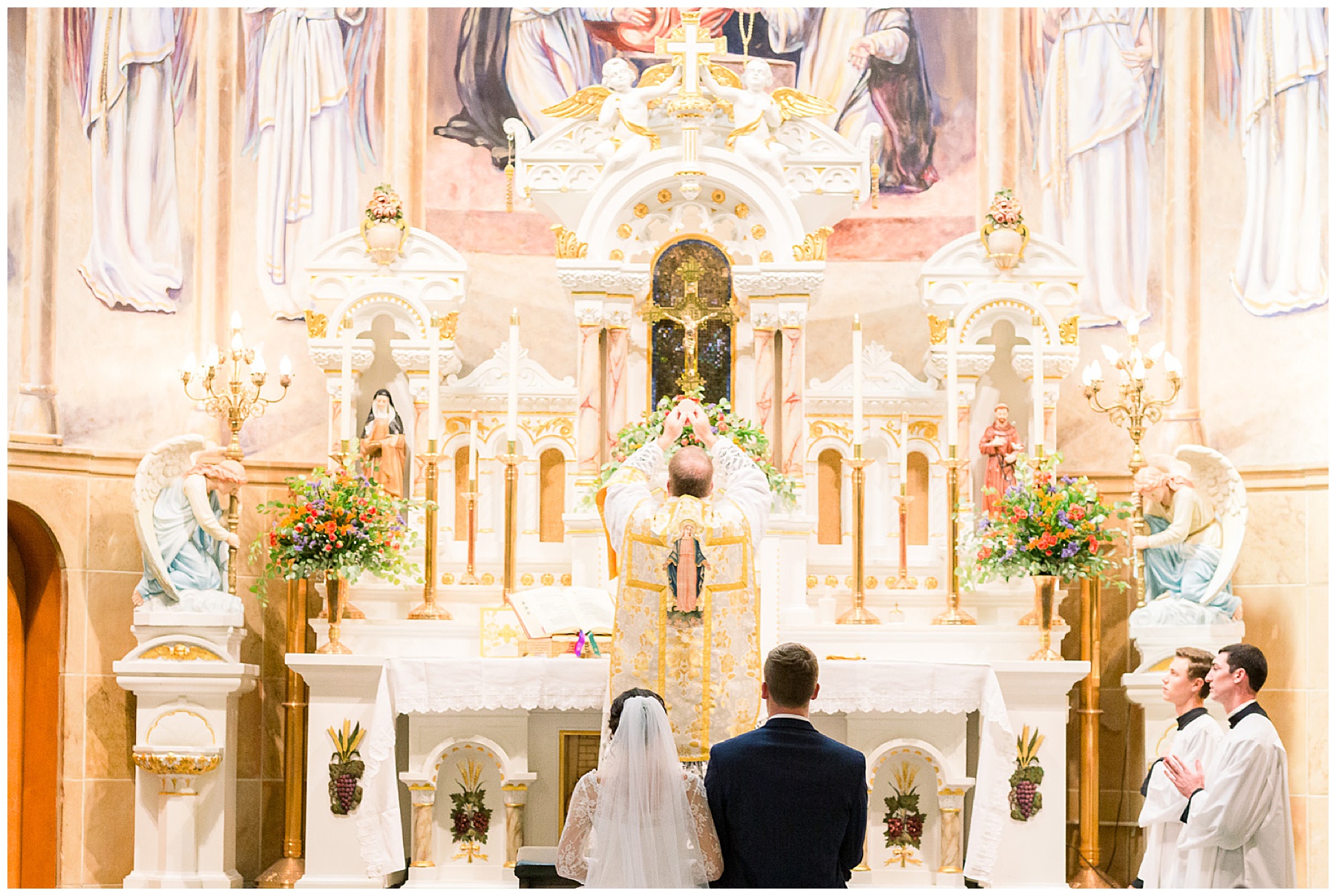 consecration-photograph-at-catholic-wedding-mass-with-bride-and-groom-our-lady-of-the-holy-rosary-catholic-church-in-indianapolis-indiana